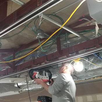 contractor retrofitting ceiling grid